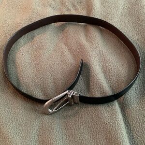 Nine West black synthetic leather with silver buckle belt. Approx 37 inches